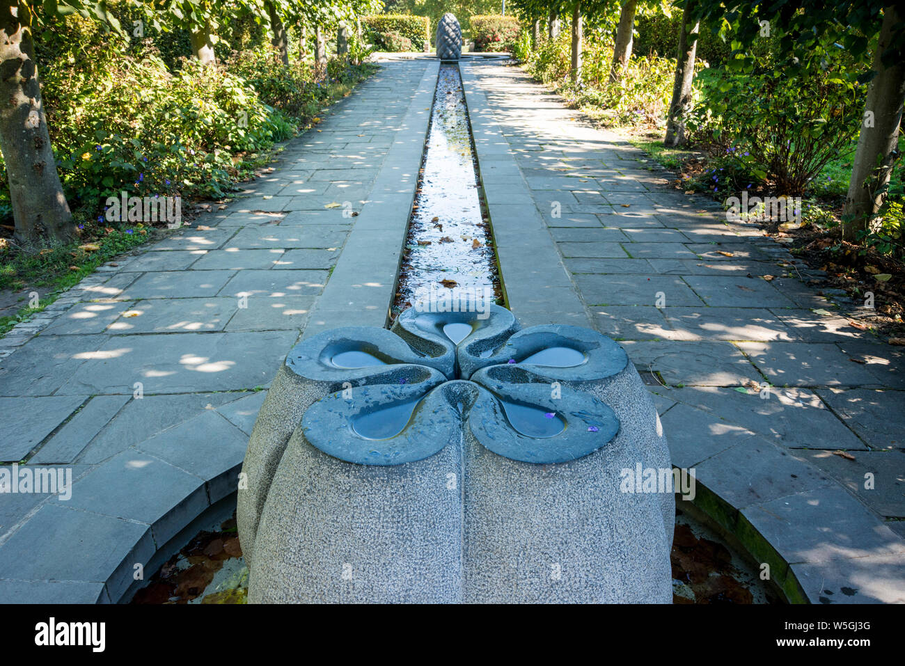 Water feature in garden adjacent to St Peter's Church in Castle Park, Broadmead, Bristol, UK Stock Photo