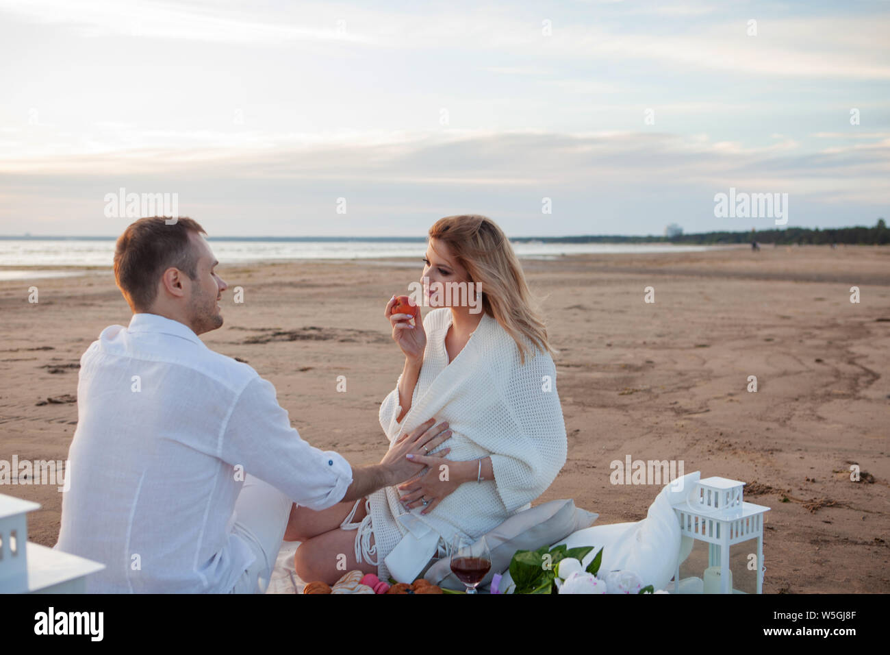 Picnic On The Beach A Man And A Pregnant Woman Had A Picnic On