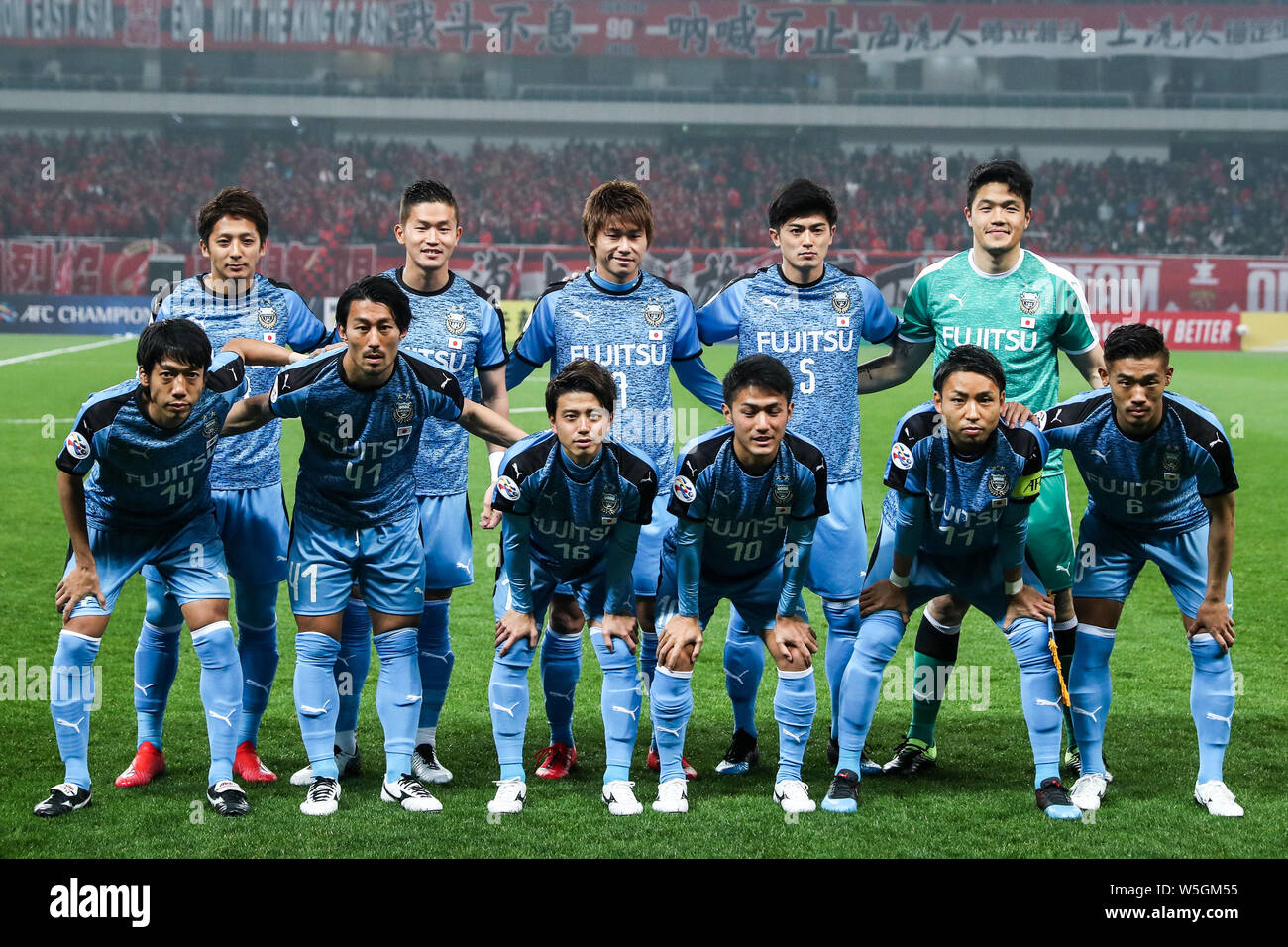Players Of The Starting Line Up Of Japan S Kawasaki Frontale F C Pose For A Group Photo Before Competing Against China S Shanghai Sipg F C In The Gr Stock Photo Alamy