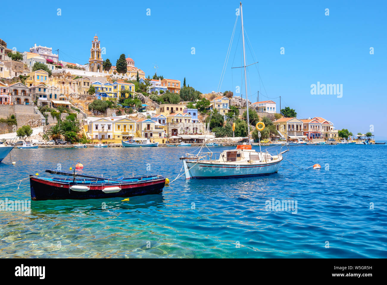 Boats at the harbor of Symi. Dodecanese Islands, Greece, Europe Stock Photo