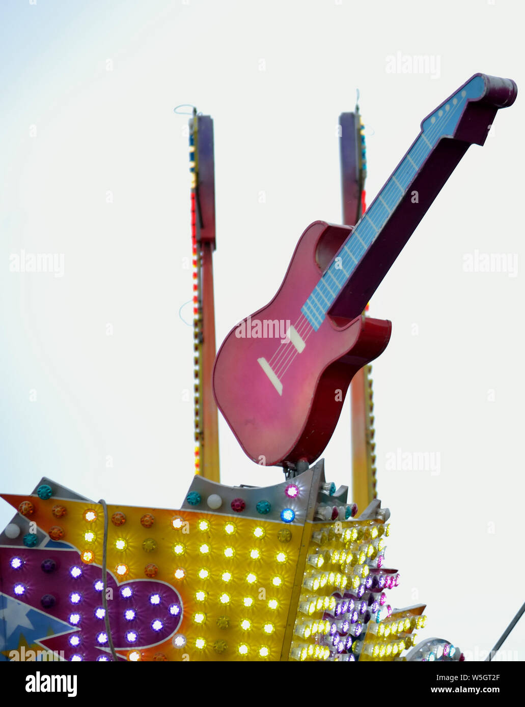 Guitar sign on amusement park ride Stock Photo