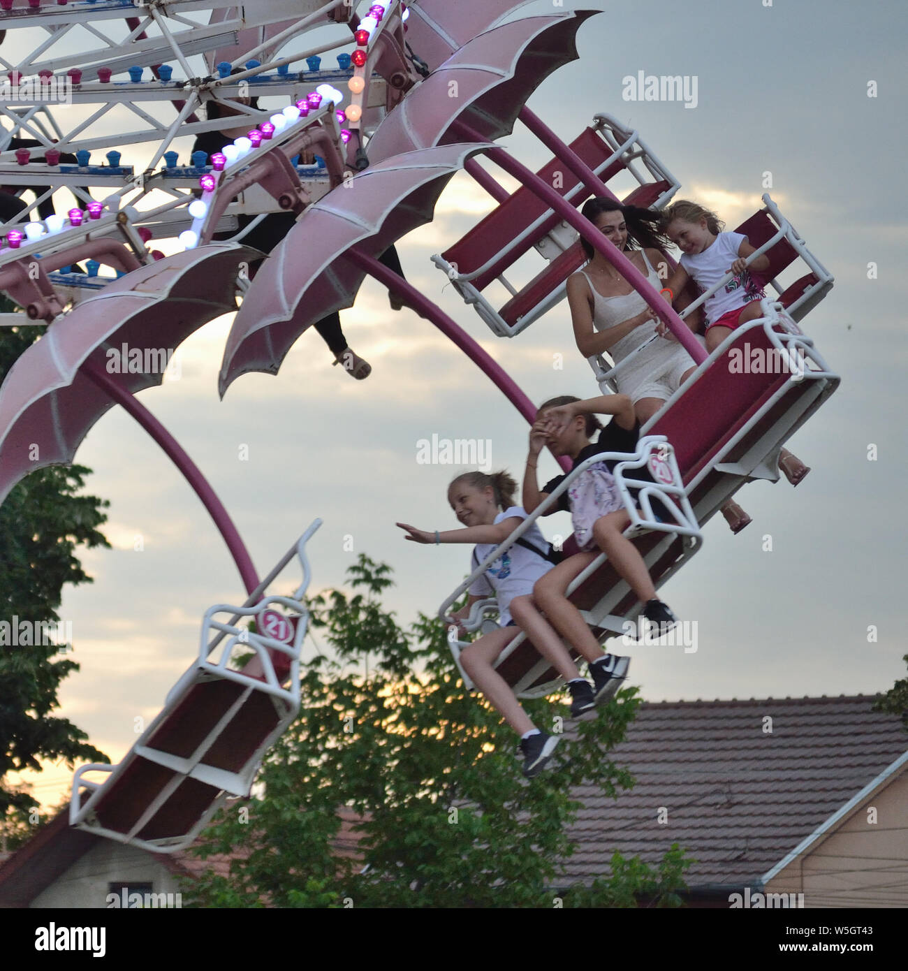 People, kids on a paratrooper, umbrella ride, Svilajnac, Serbia, Europe