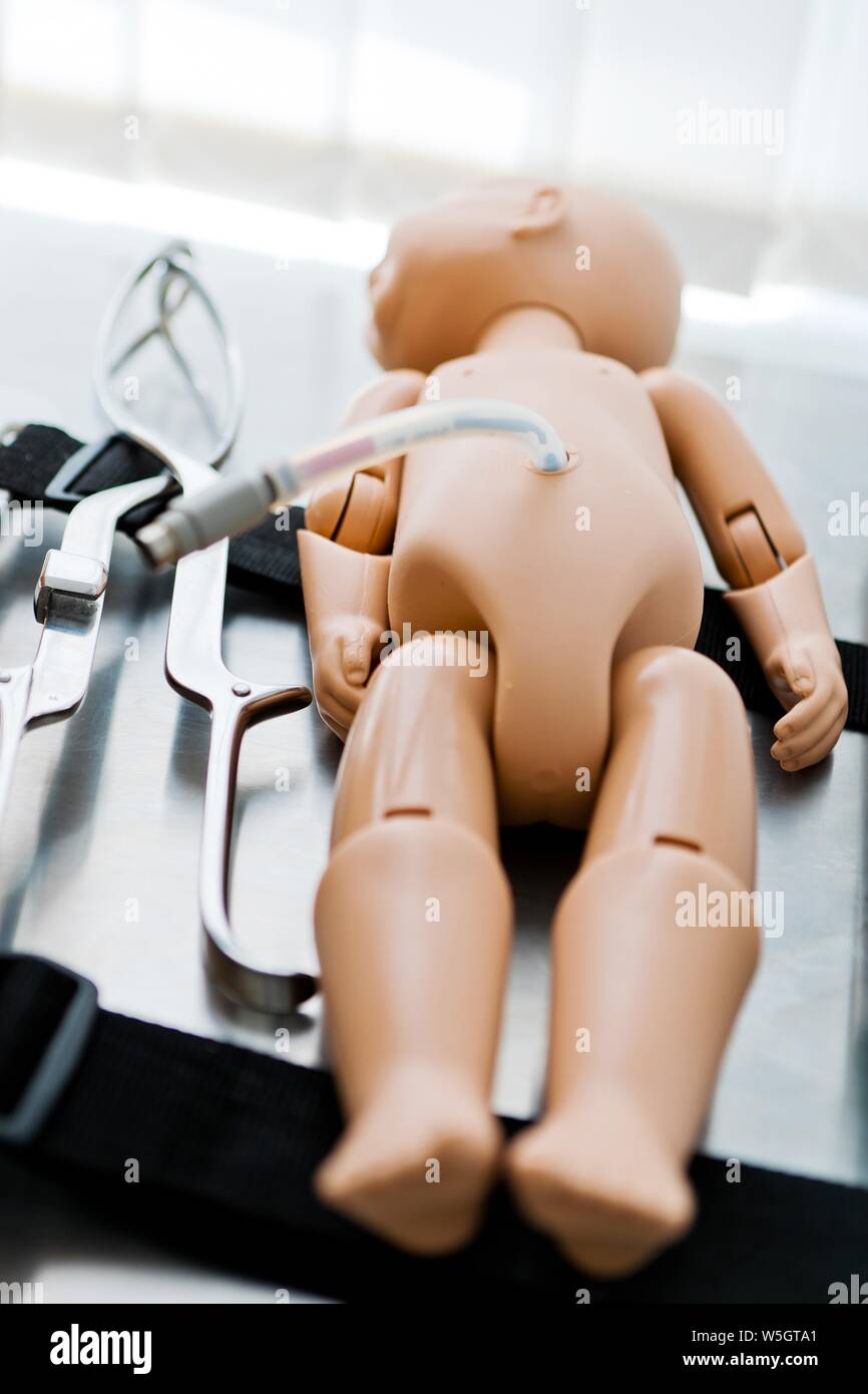 https://c8.alamy.com/comp/W5GTA1/newborn-mannequin-and-birth-tools-model-for-childbirth-simulation-W5GTA1.jpg