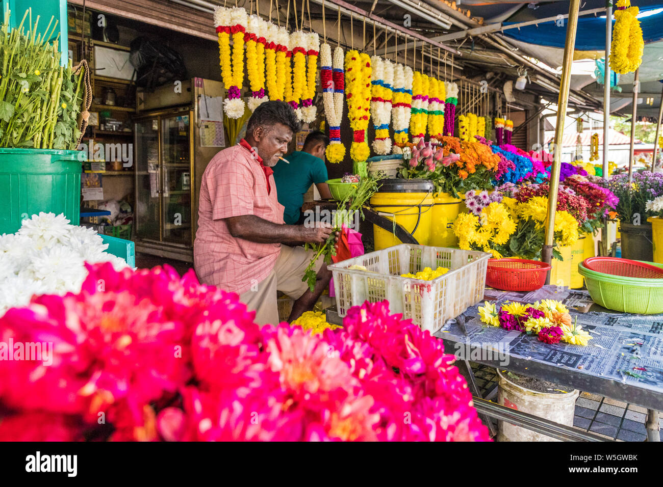 Colourful traditional garland maker in Town, UNESCO World