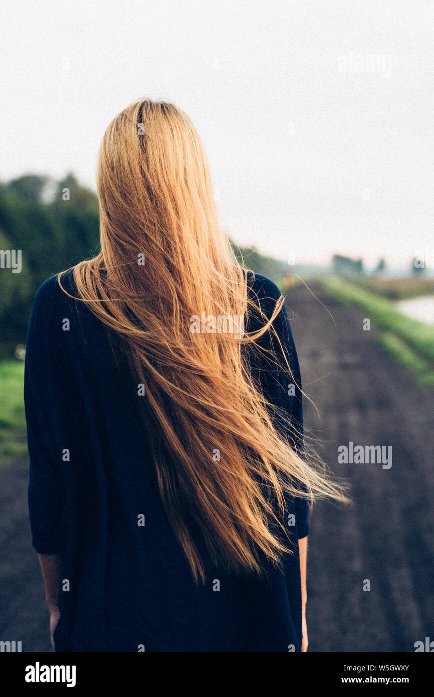 Unrecognizable lonely girl long hair hi-res stock photography and images -  Alamy