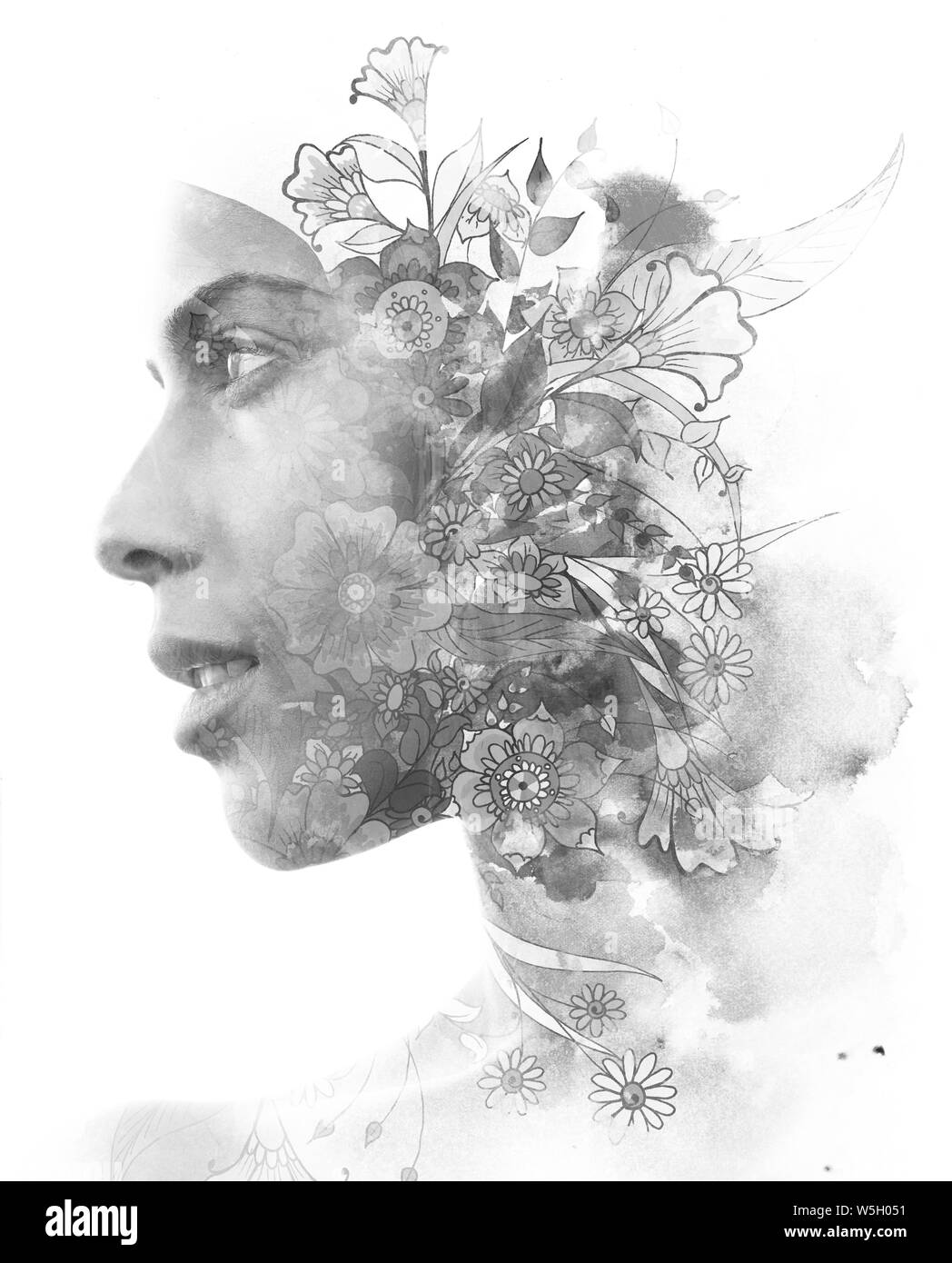 Double exposure. Paintography. Portrait of a beautiful young female model disappearing behind black ink painting on white background Stock Photo