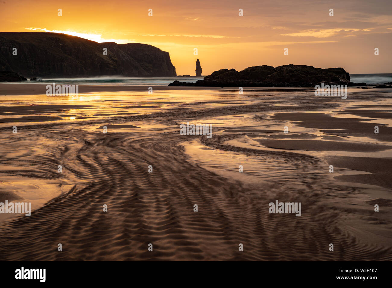 Am Buachaille sea stack at sunset, Sandwood Bay, Sutherland, Scotland, United Kingdom, Europe Stock Photo