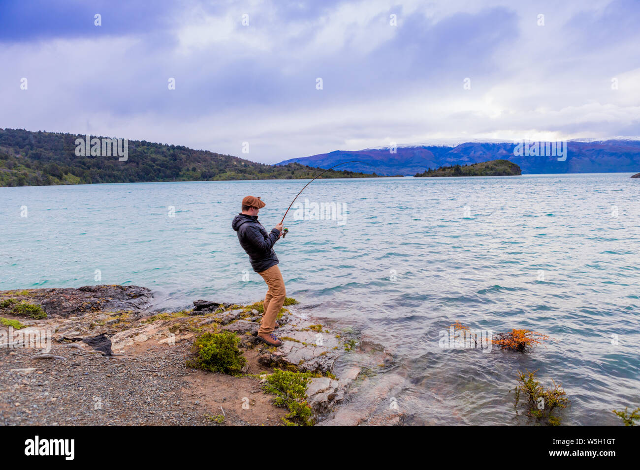 Fishing in Toro Lake, Patagonia, Chile, South America Stock Photo