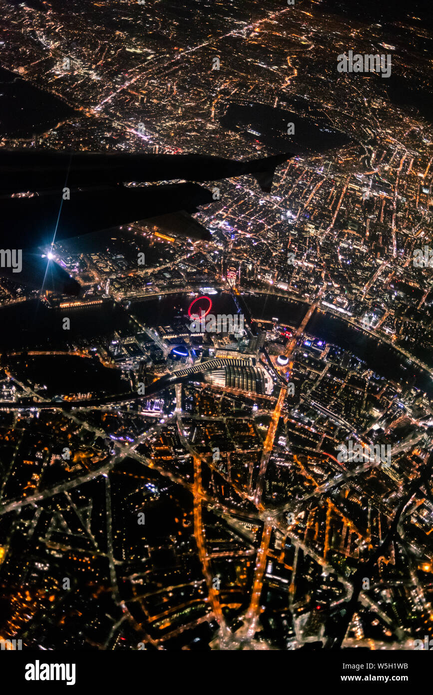 View over London at night from an airplane window, London, England, United Kingdom, Europe Stock Photo