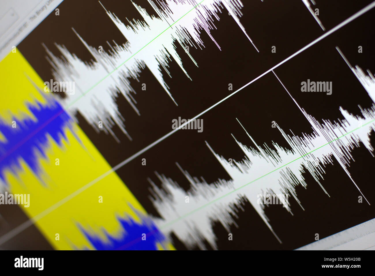 Sound visualization in a professional audio editing software. Computer screen close up. Stock Photo