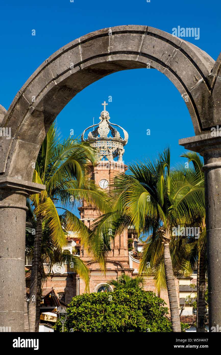 Our Lady of Guadalupe church through the Malecon arches, Puerto Vallarta, Jalisco, Mexico, North America Stock Photo