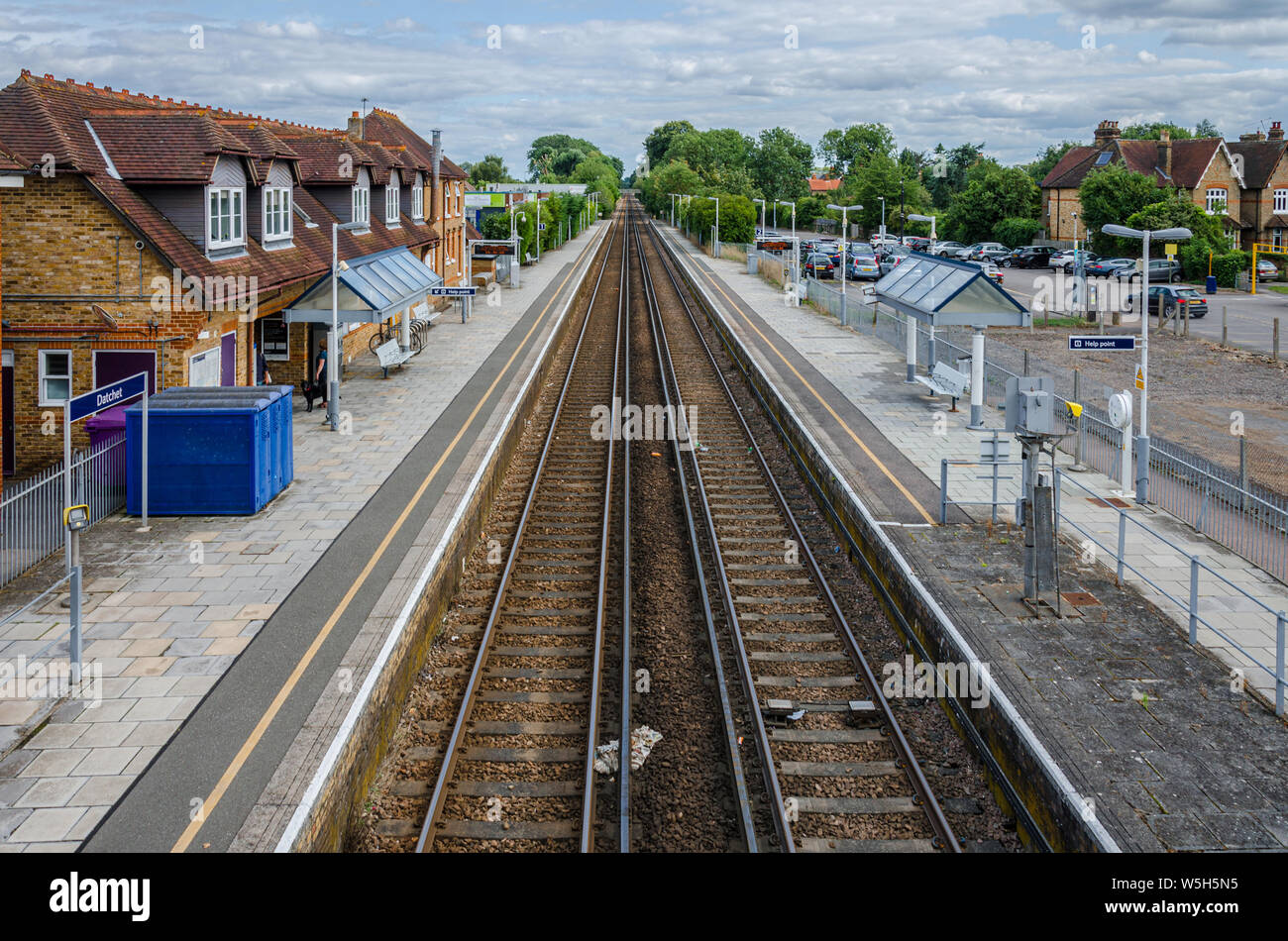 Double tracks pass through Datchet Railway Station and disappear into the distance. Stock Photo