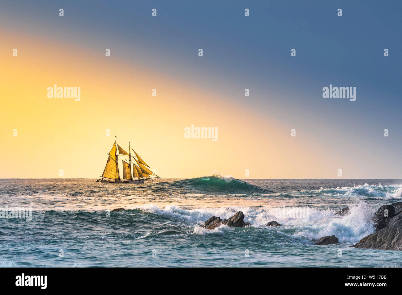 The schooner Anny owned by Rolf Munding under full sail sailing past Fistral in Newquay in Cornwall. Stock Photo