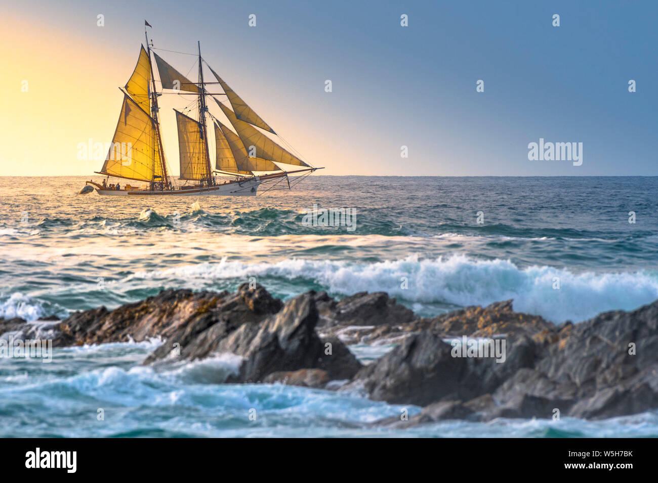 The schooner Anny owned by Rolf Munding under full sail sailing past Fistral in Newquay in Cornwall. Stock Photo