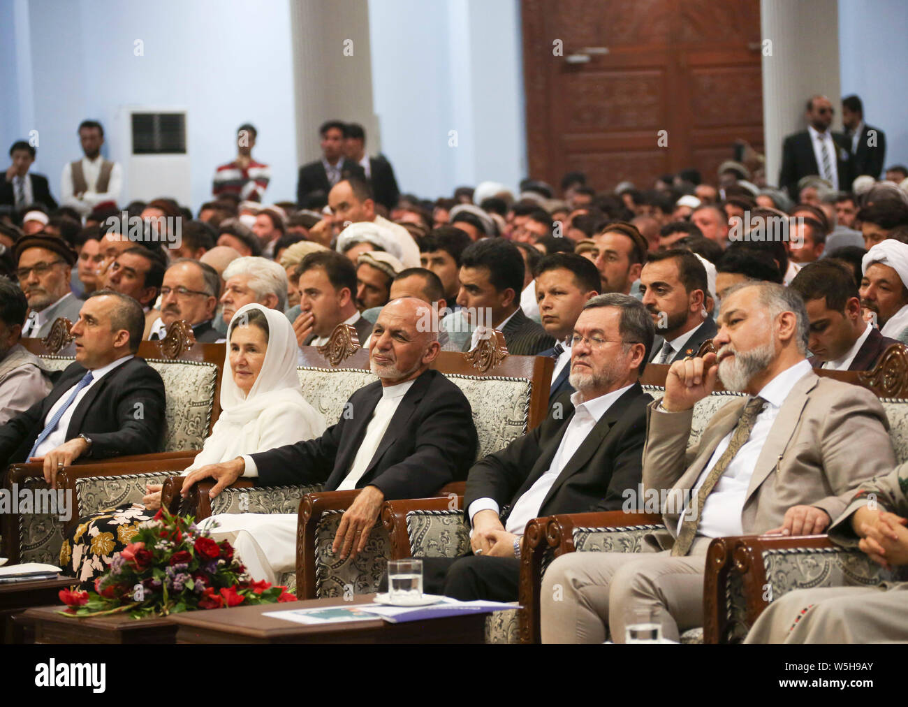 Kabul, Afghanistan. 28th July, 2019. Afghan presidential candidate Mohammad Ashraf Ghani (C, front) attends an election campaign in Kabul, capital of Afghanistan, July 28, 2019. Campaign for the Afghan presidential election in late September started on July 28 amid growing attacks and fear of frauds in the militancy-plagued country. A total of 18 candidates, including incumbent President Mohammad Ashraf Ghani, embarked on a two-month campaign which will conclude on Sept. 25. Credit: Rahmatullah Alizadah/Xinhua/Alamy Live News Stock Photo