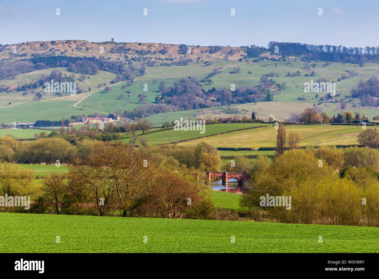 A view of Bredon hill tower and Eckington bridge over the river Avon