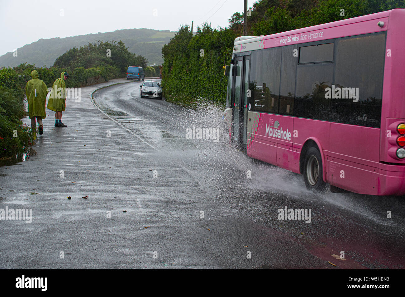 Mousehole, Cornwall, UK. 29th July 2019. UK Weather. Today is national 'Rain Day', and the weather didn't dissapoint at Mousehole, Cornwall, with heavy downpours throughout the day. Credit Simon Maycock / Alamy Live News. Stock Photo
