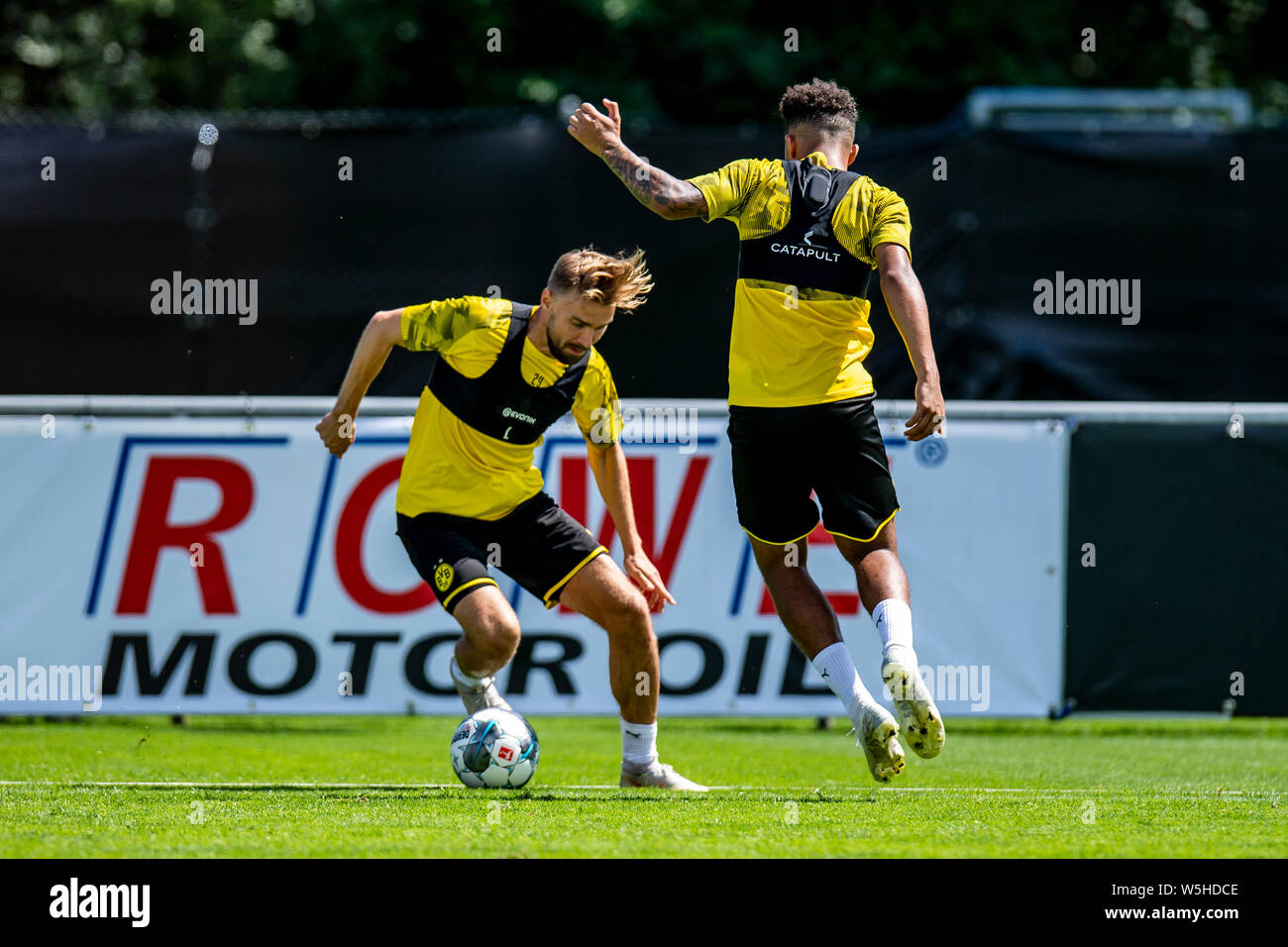 Bad Ragaz, Switzerland. 29th July, 2019. Soccer, training camp Borussia:  Dortmund Dortmund's Marcel Schmelzer (l) and Dortmund's Jadon Sancho fight  for the ball. Credit: David Inderlied/dpa/Alamy Live News Stock Photo -  Alamy