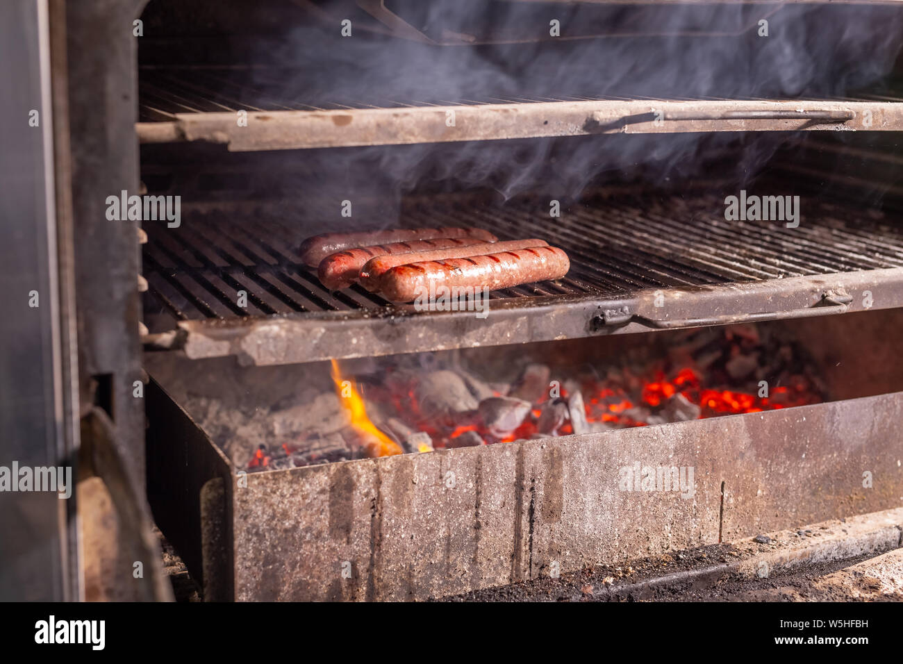 food, delicious and craft concept grilled sausage on the flaming