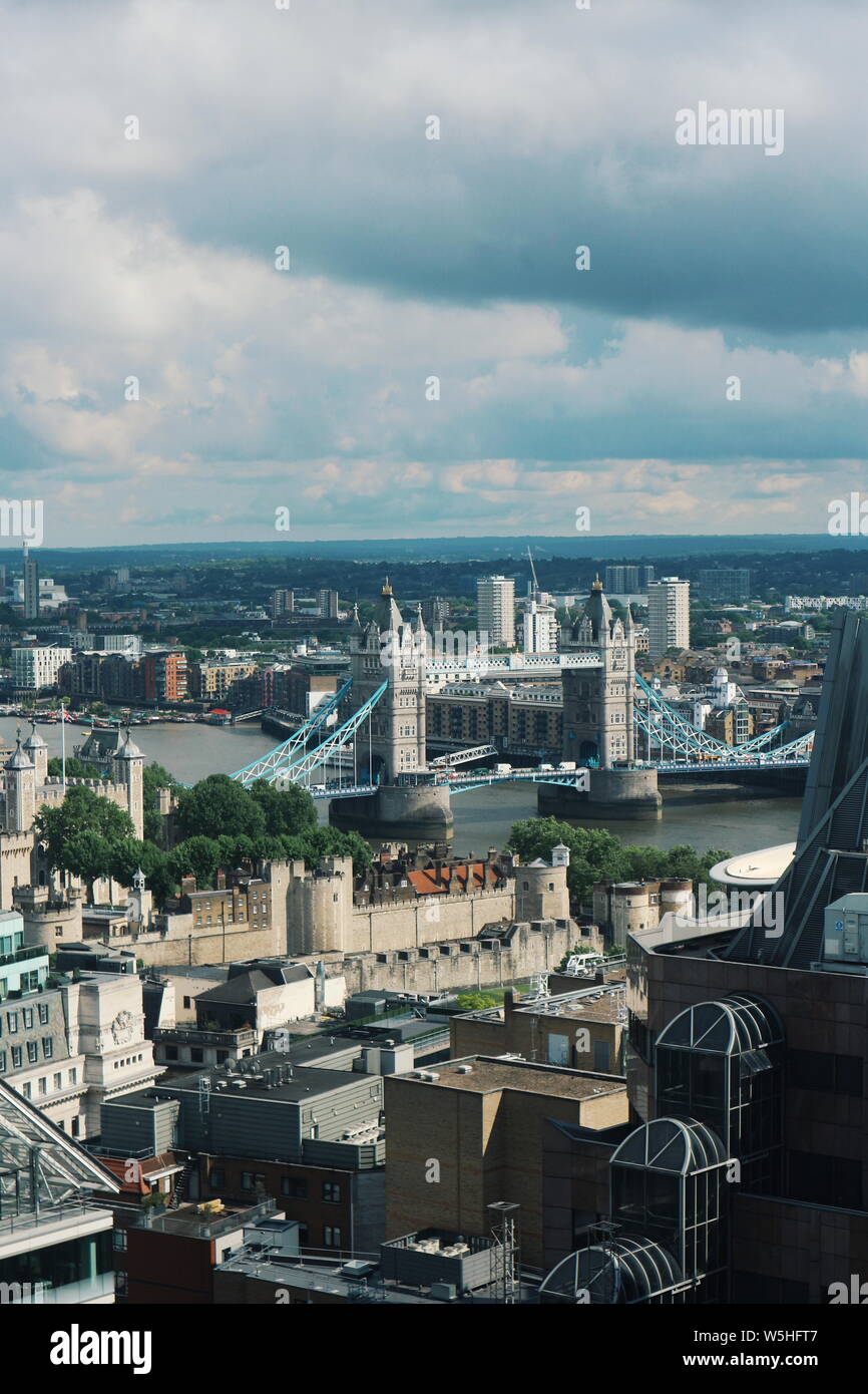 The city of London shot from the Sky Garden in southwestern direction. In the distance is the Tower of London and the Tower Bridge. Stock Photo