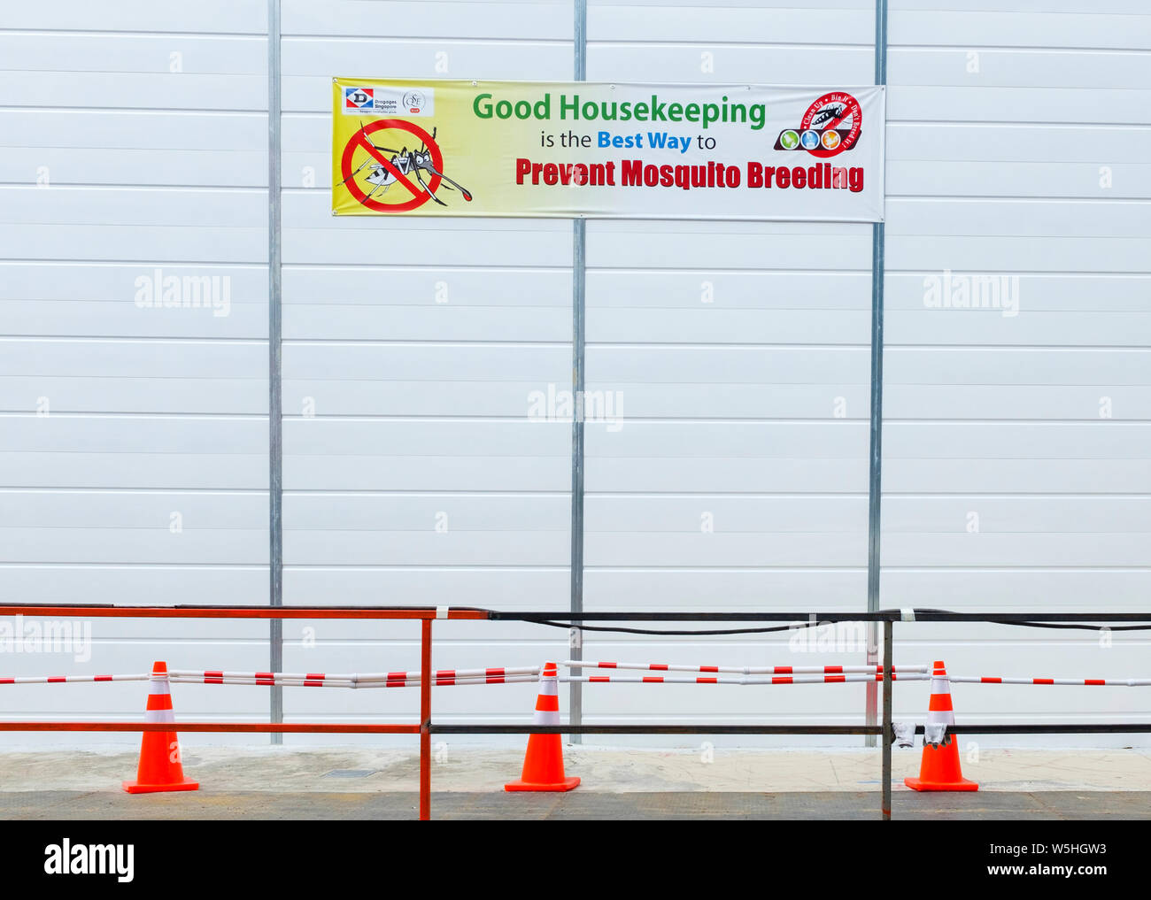 Sign promoting public health stating that good housekeeping helps prevent mosquitoes breeding, Singapore Stock Photo