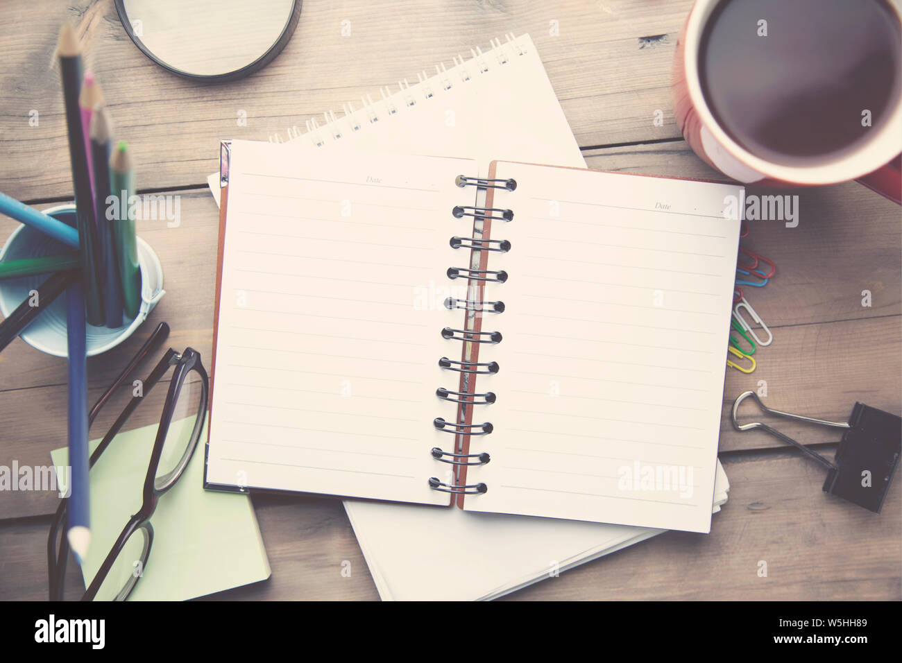 working wooden table on different office accessories Stock Photo