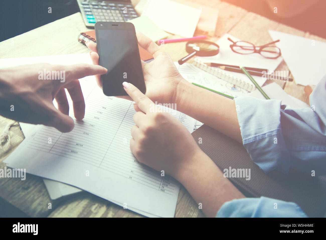 Team meting. phone,papers and different items   on the table Stock Photo