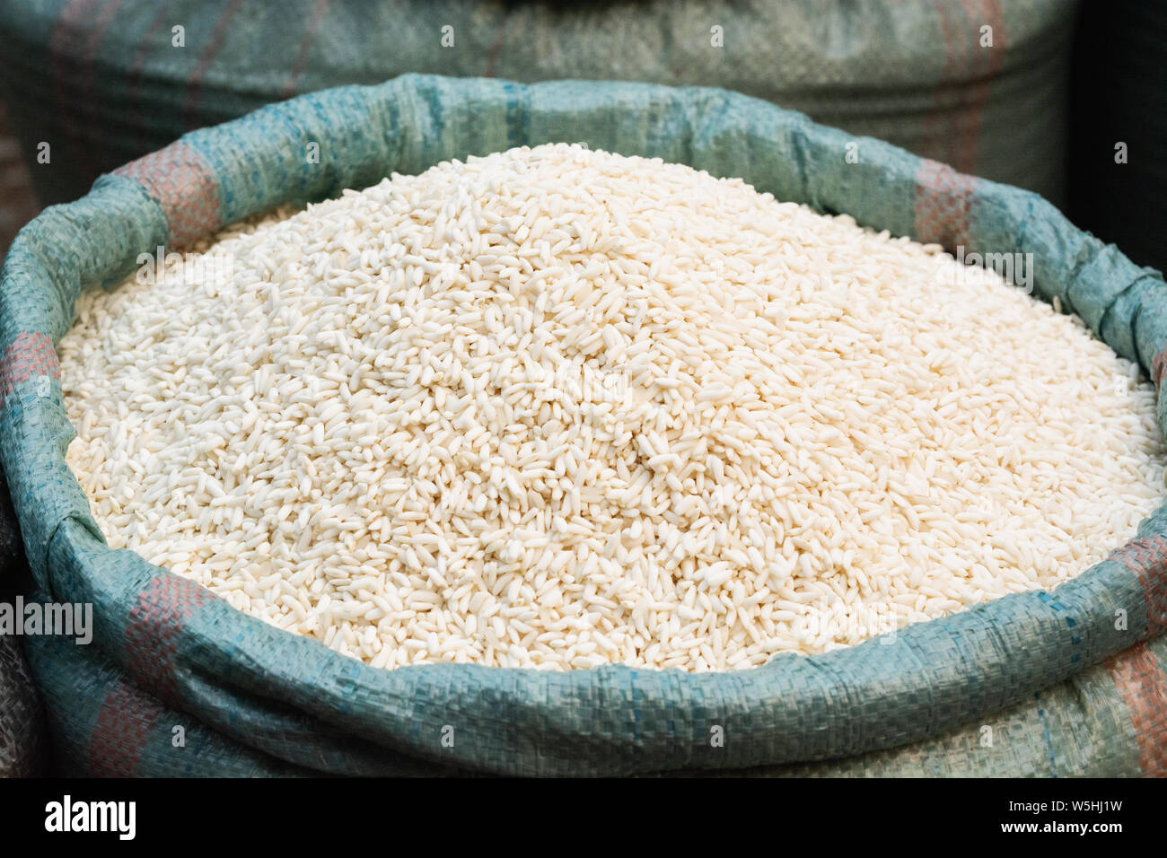 Open bag full of white rice on the asian market Stock Photo Alamy