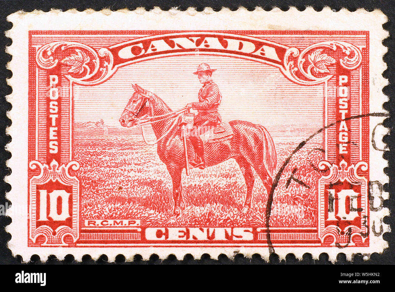 Royal canadian mounted policeman on vintage stamp Stock Photo