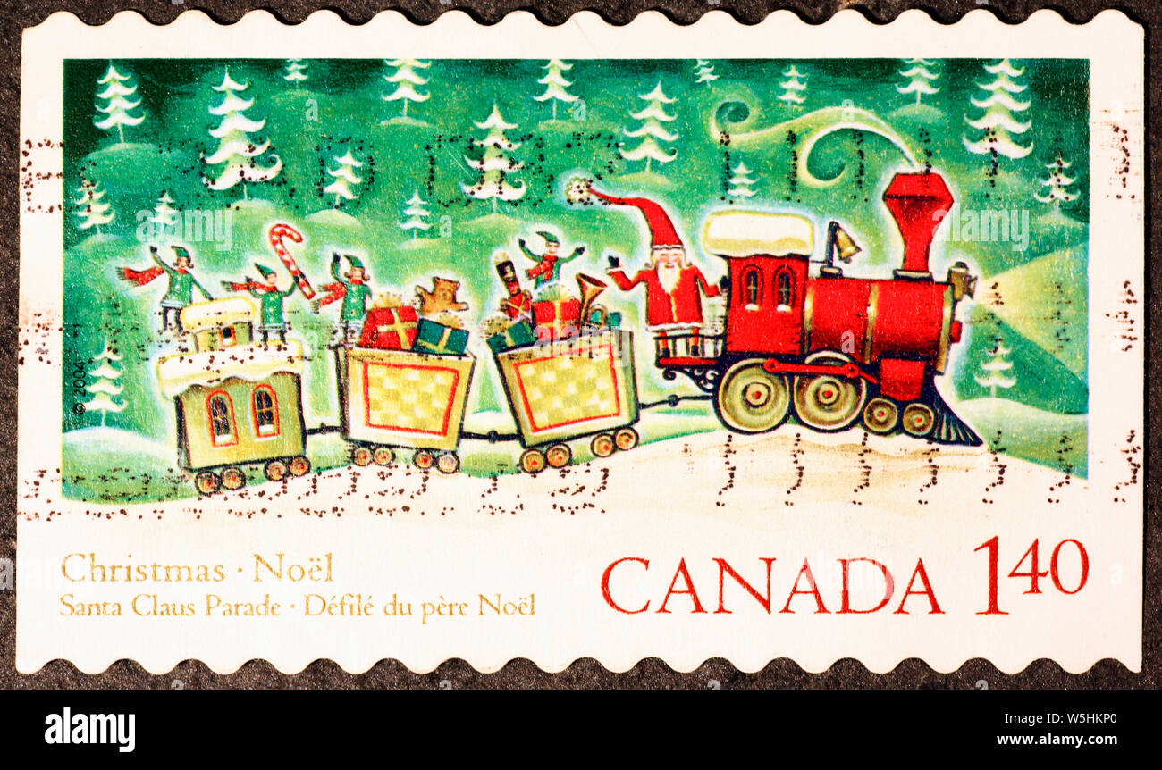 Santa Claus on train in canadian postage stamp Stock Photo Alamy