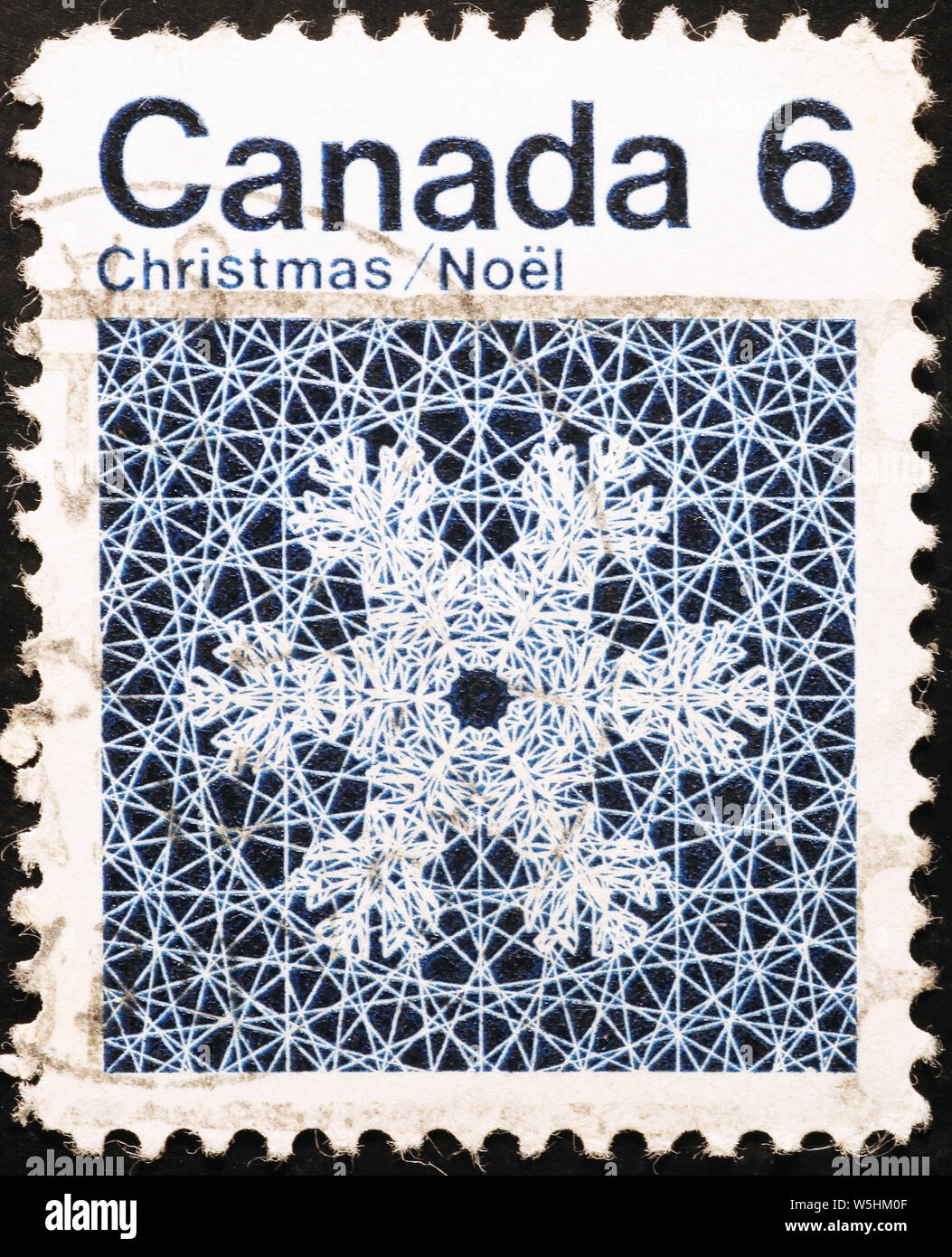 Snowflake on canadian postage stamp Stock Photo
