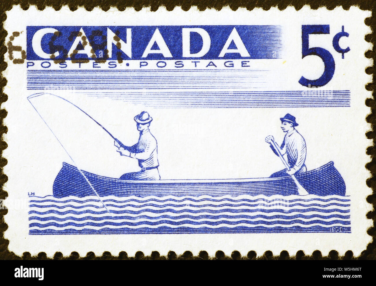Vintage canadian postage stamp with two fishermen in a canoe Stock Photo
