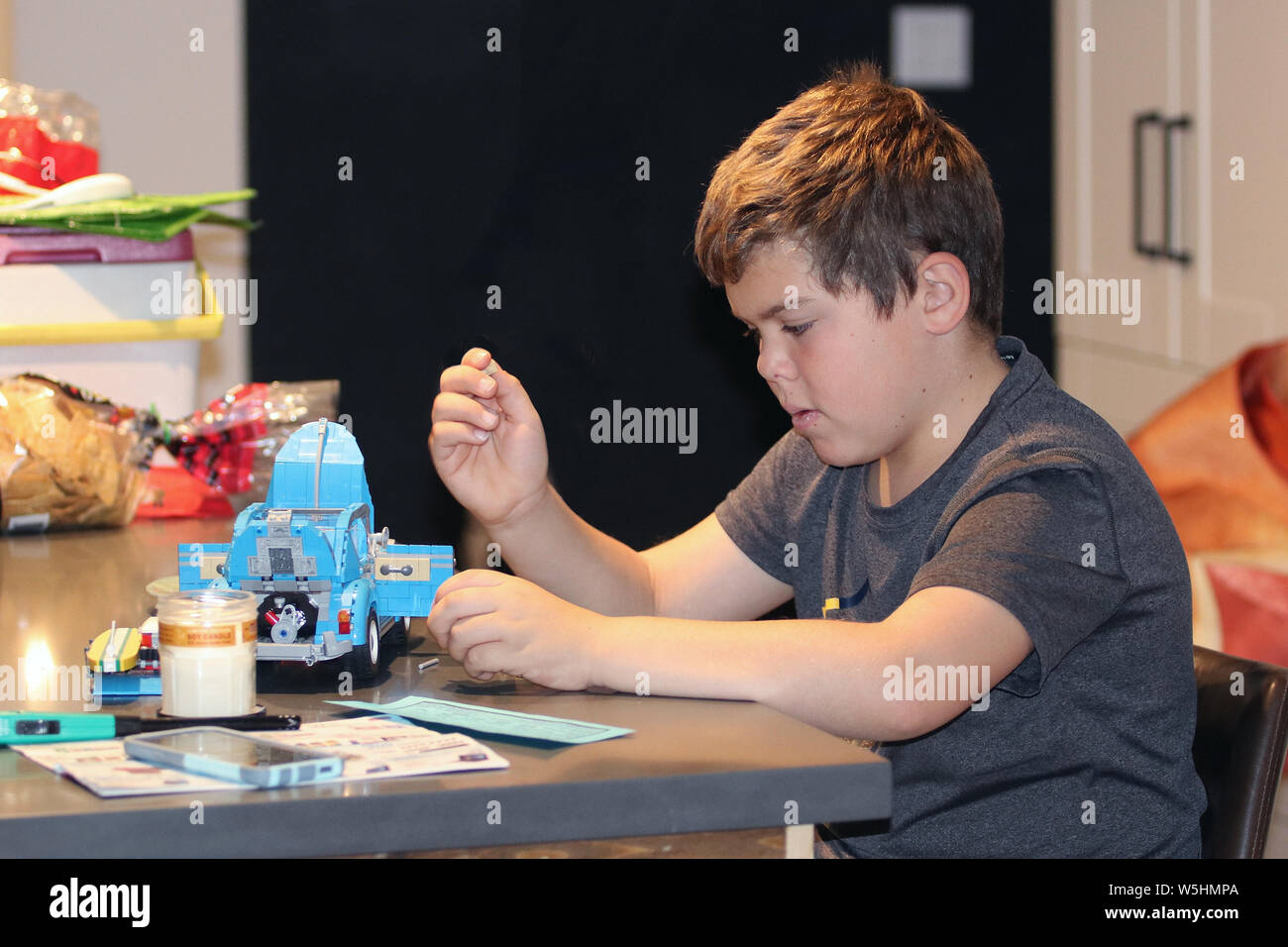 Boy Building Model From Blocks Stock Photo - Alamy