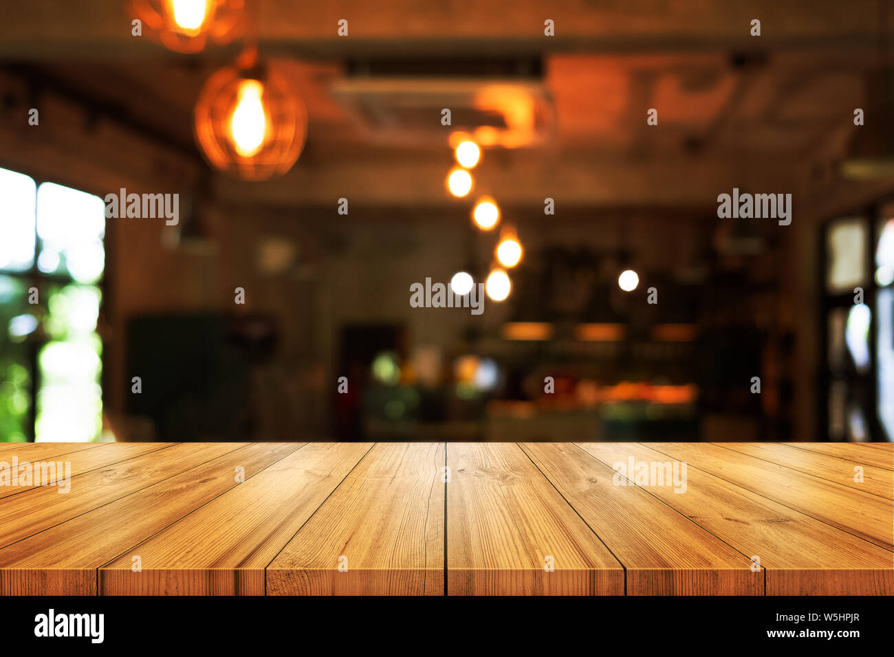 Empty wooden table top with blurred coffee shop or restaurant interior  background. can be used product display Stock Photo - Alamy