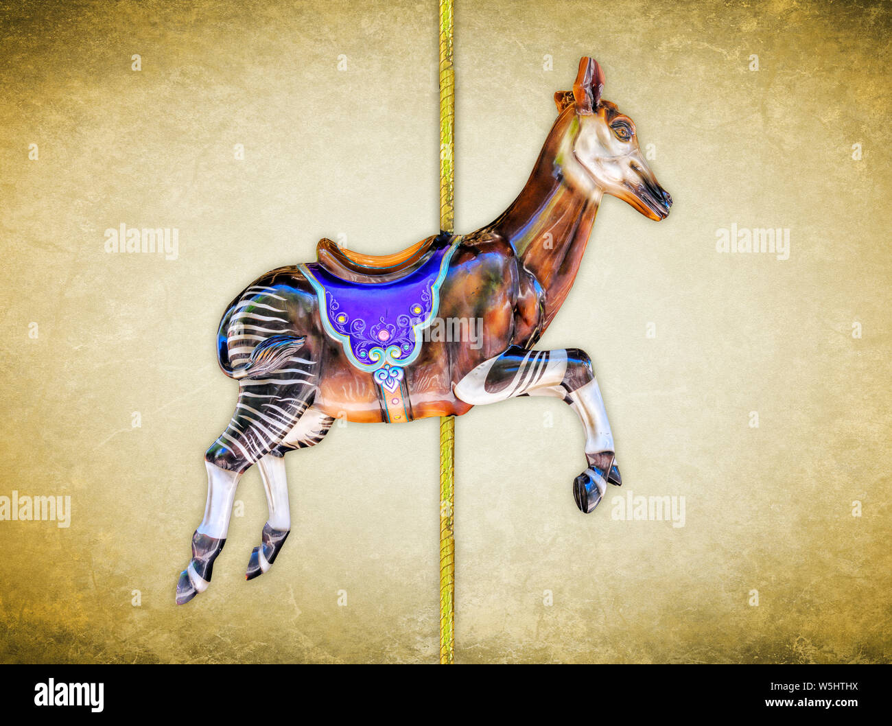 Carnival carousel okapi isolated on blue or gold background Stock Photo