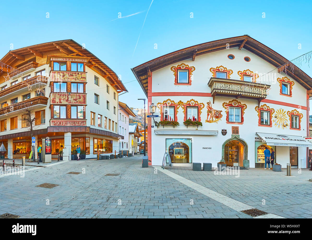 ZELL AM SEE, AUSTRIA - FEBRUARY 28, 2019: Panorama of old town street with classic Alpine houses, occupied with hotels, cafes and stores, on February Stock Photo