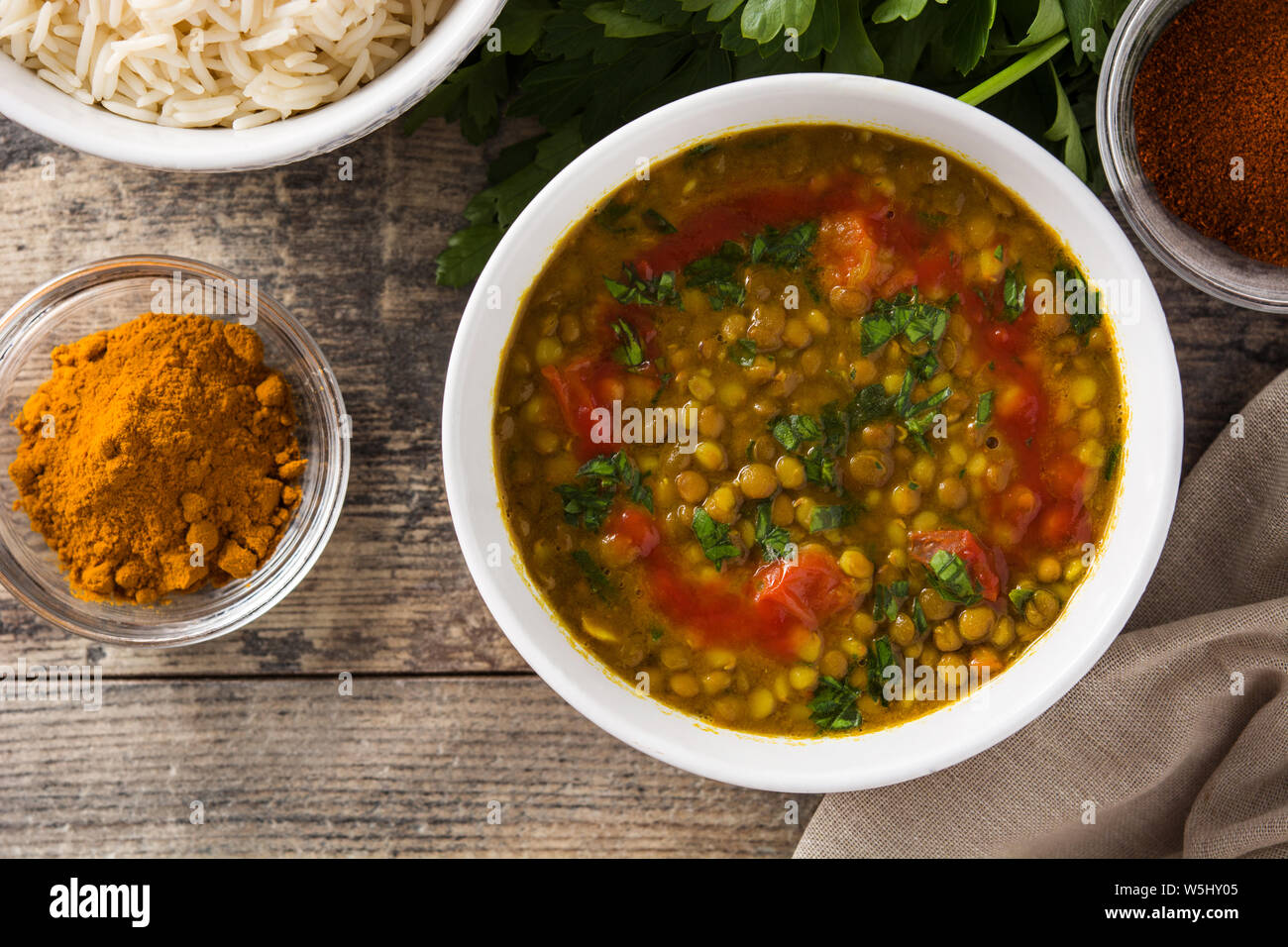 Indian lentil soup dal (dhal) in a bowl on wooden table. Top view Stock ...
