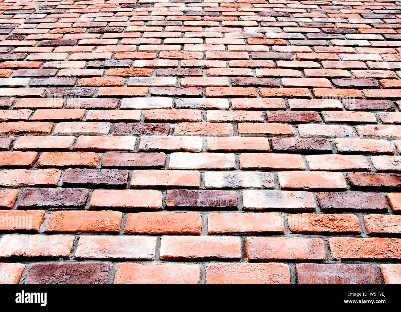 Bottom view brick wall texture and background Stock Photo - Alamy