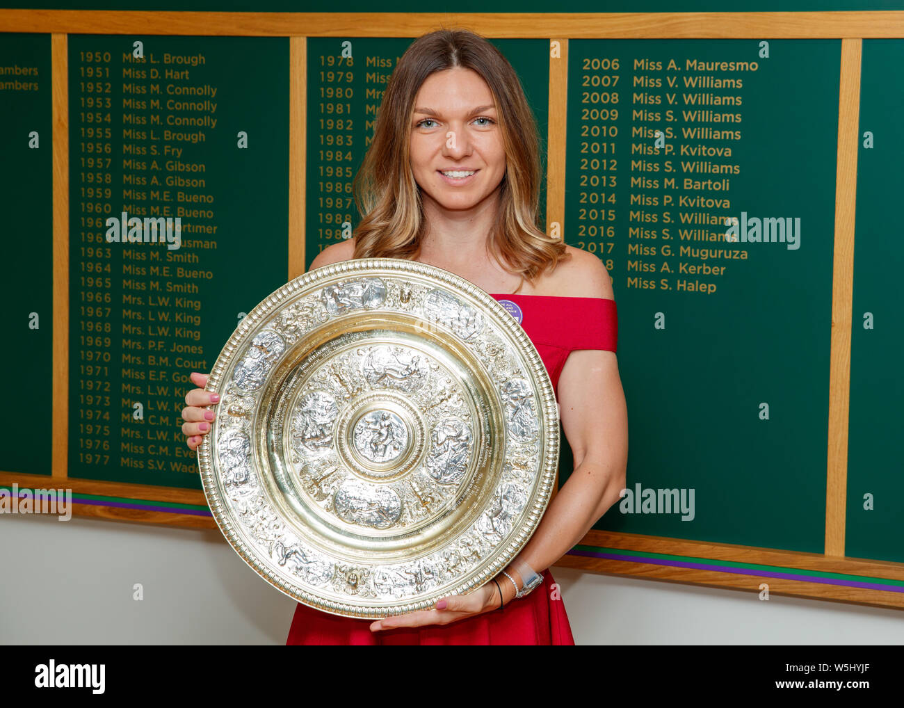 Simona Halep (ROU) with the 2019 Wimbledon Ladies' Singles Trophy at The All England Lawn Tennis Club, Wimbledon. Stock Photo