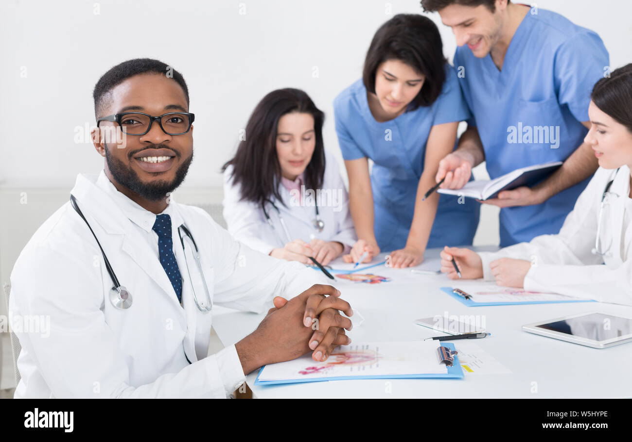 Practitioners and interns at meeting in medical office Stock Photo Alamy