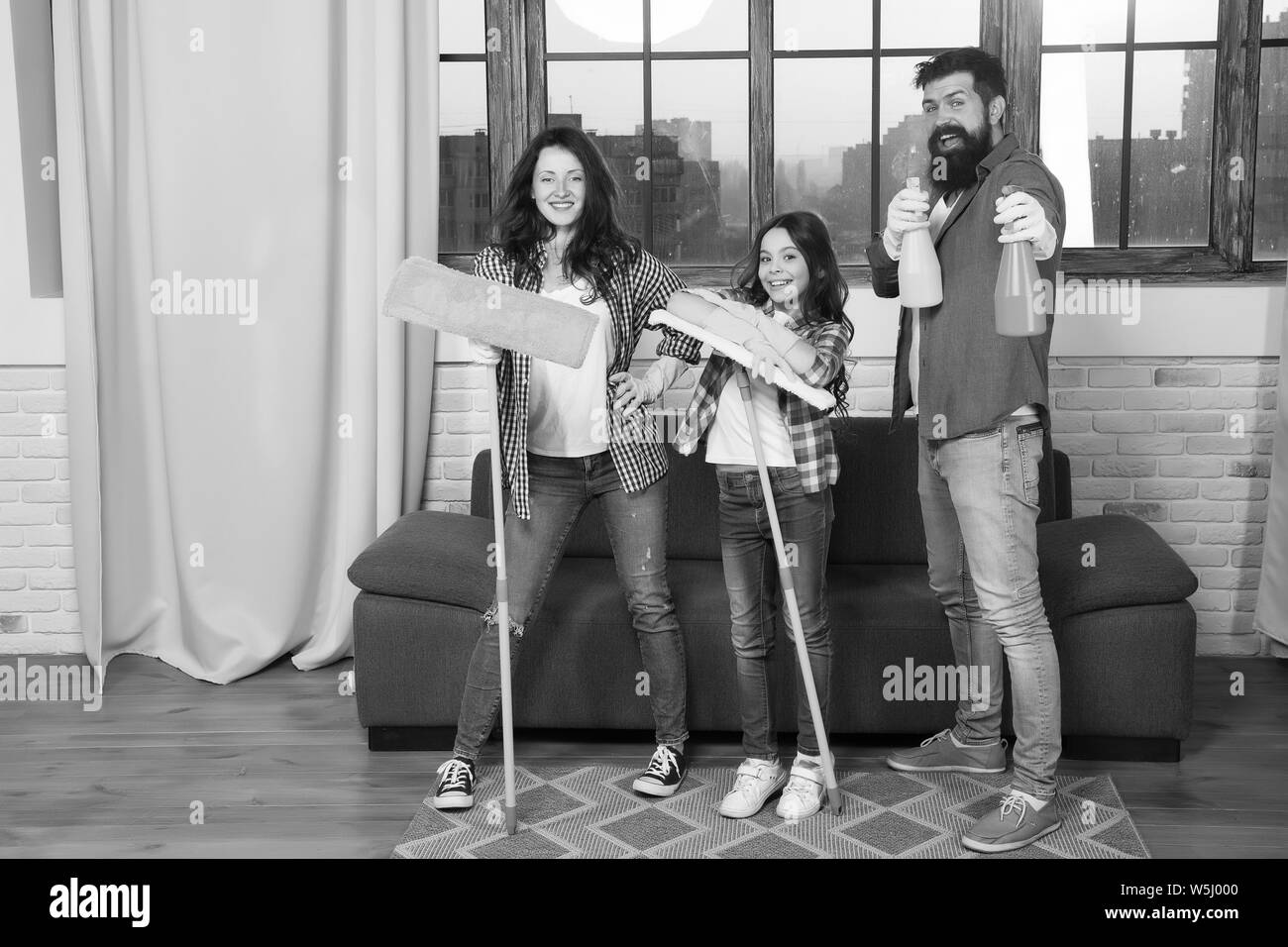 Cleaning day. Family mom dad and daughter with cleaning supplies at