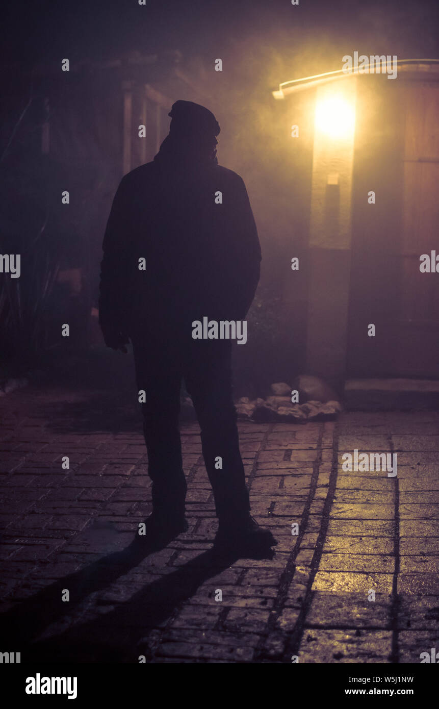 man silhouette and light at night Stock Photo