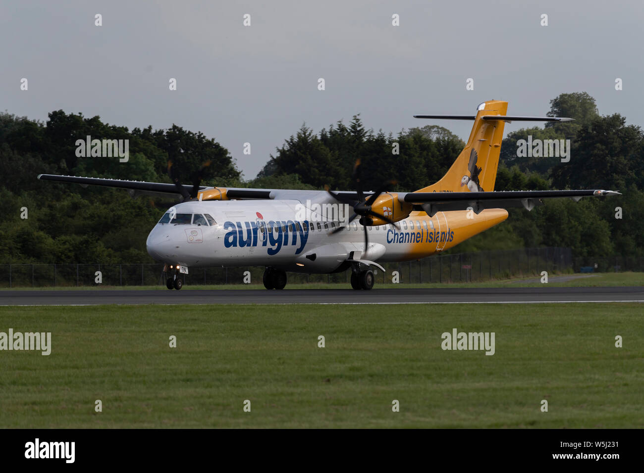 An Aurigny Air Services ATR 72-500 lands at Manchester International Airport (Editorial use only) Stock Photo