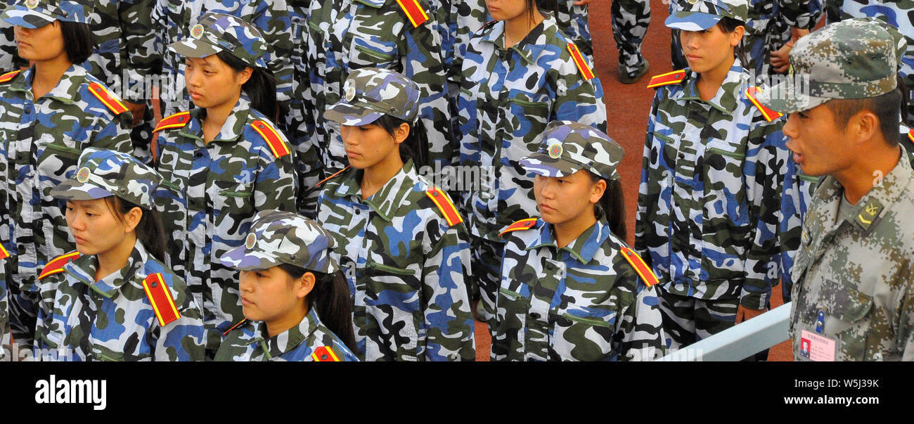 Young female Chinese first year university students do drill practice Stock Photo