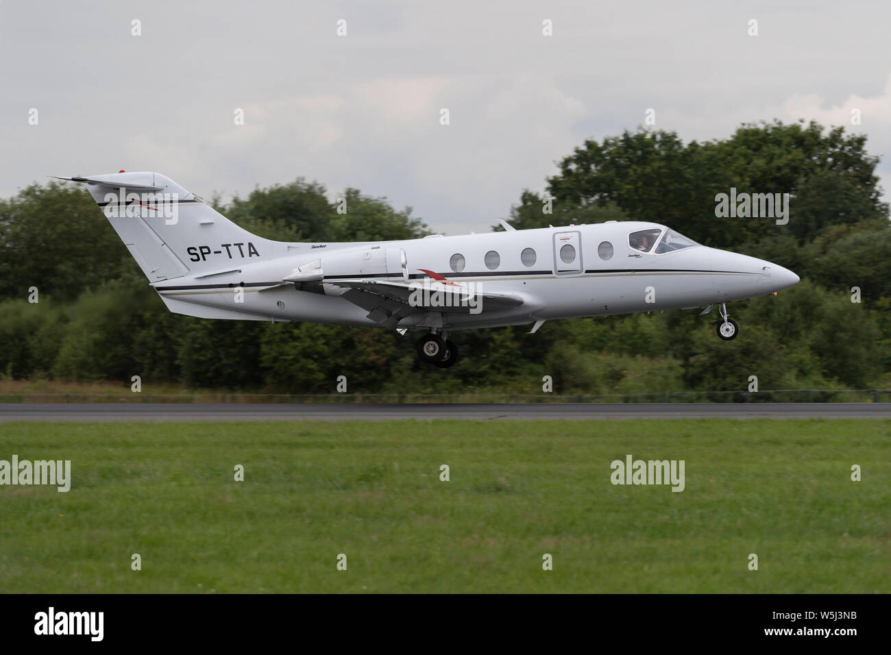 A Hawker 400XP lands at Manchester International Airport (Editorial use only) Stock Photo