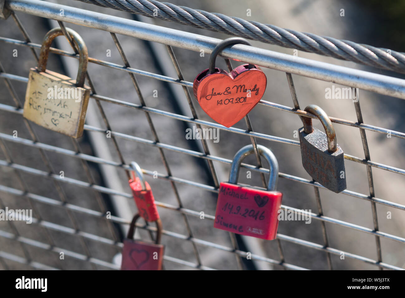 grungy love padlocks with heart decoration Stock Photo