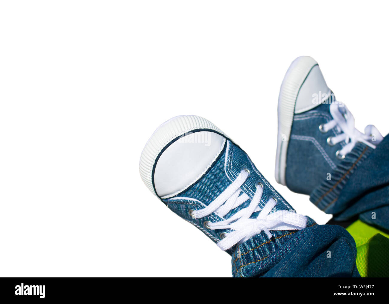Close-up on child feet with sneakers. Stock Photo