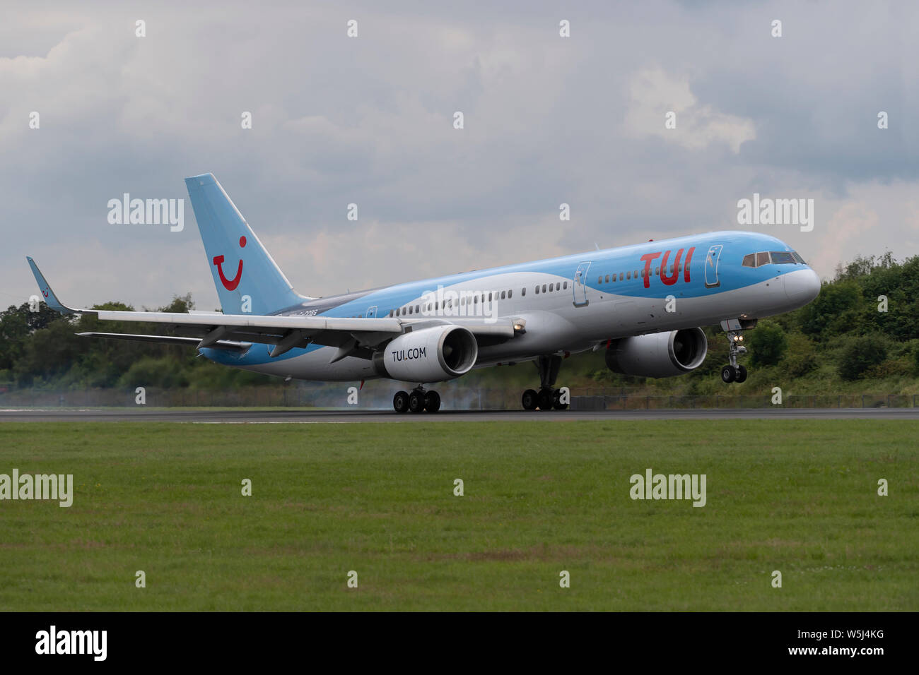 A TUI Airways Boeing 757-200 lands at Manchester International Airport (Editorial use only) Stock Photo
