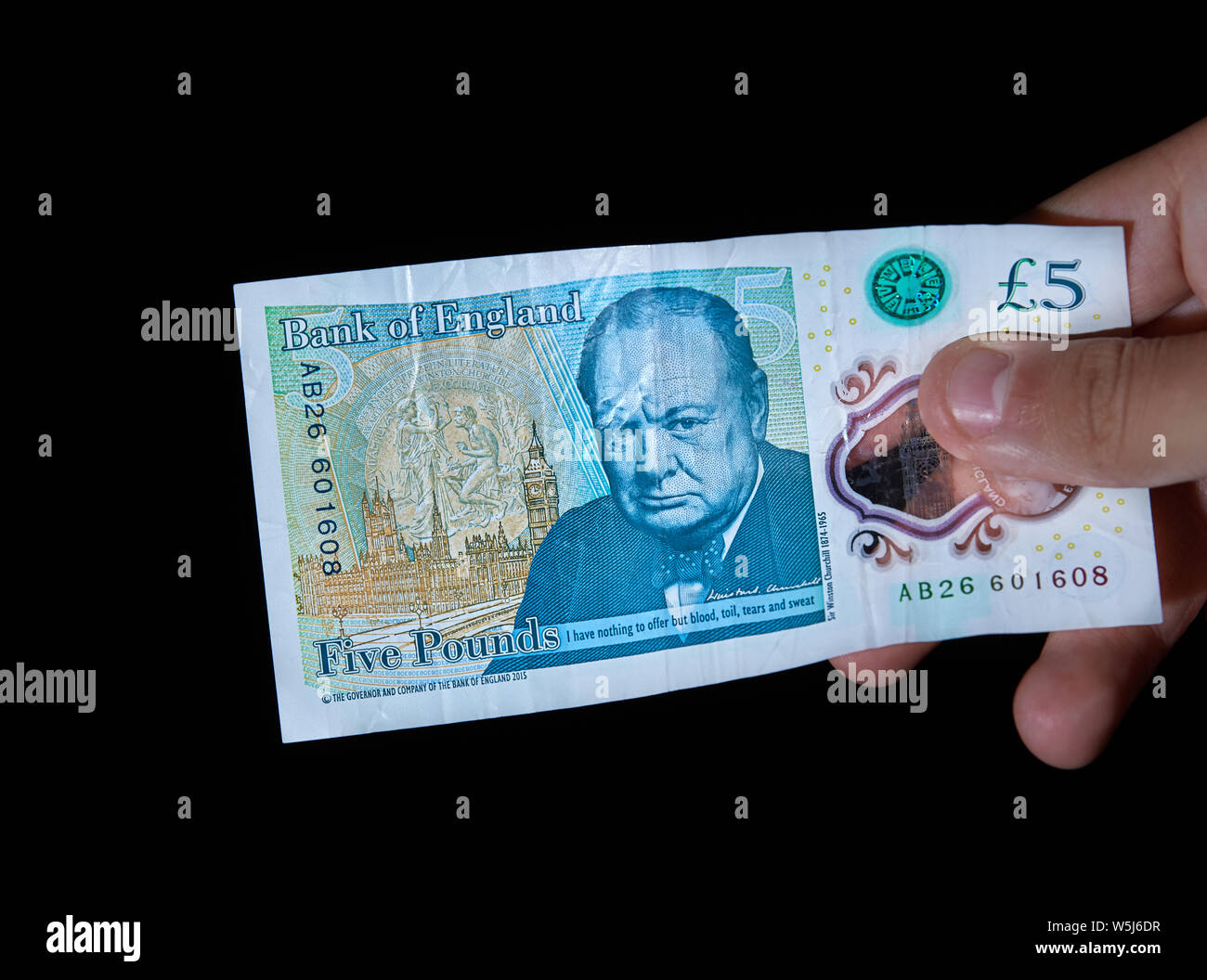 Engish £5 note featuring a portrait of Winston Churchill and words from his famous World War II speech Stock Photo