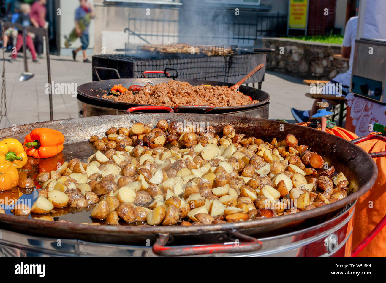 Food cooked in a giant wok pan at old town square in Prague Czech Republic  Europe Stock Photo - Alamy